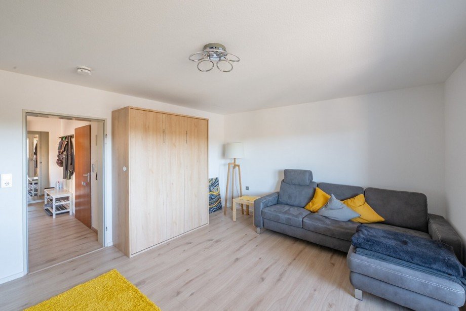 Wohnzimmer mit Schrankbett Etagenwohnung Tennenbronn
